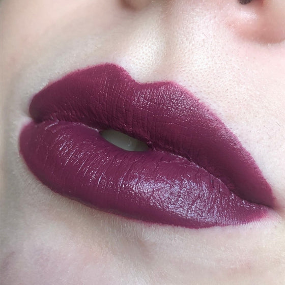 A close up of lips with a model wearing A close up of lips with a model wearing Fierce Semi-Matte Lipstick Semi-Matte Lipstick
