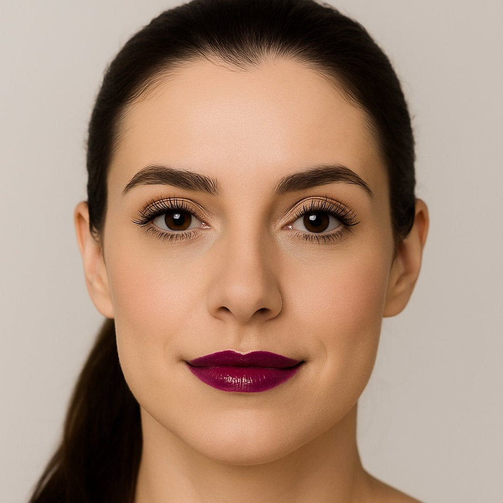 Model wearing Lucky Chick Hydrating Lip Gloss in Royal – deep purple glossy lips