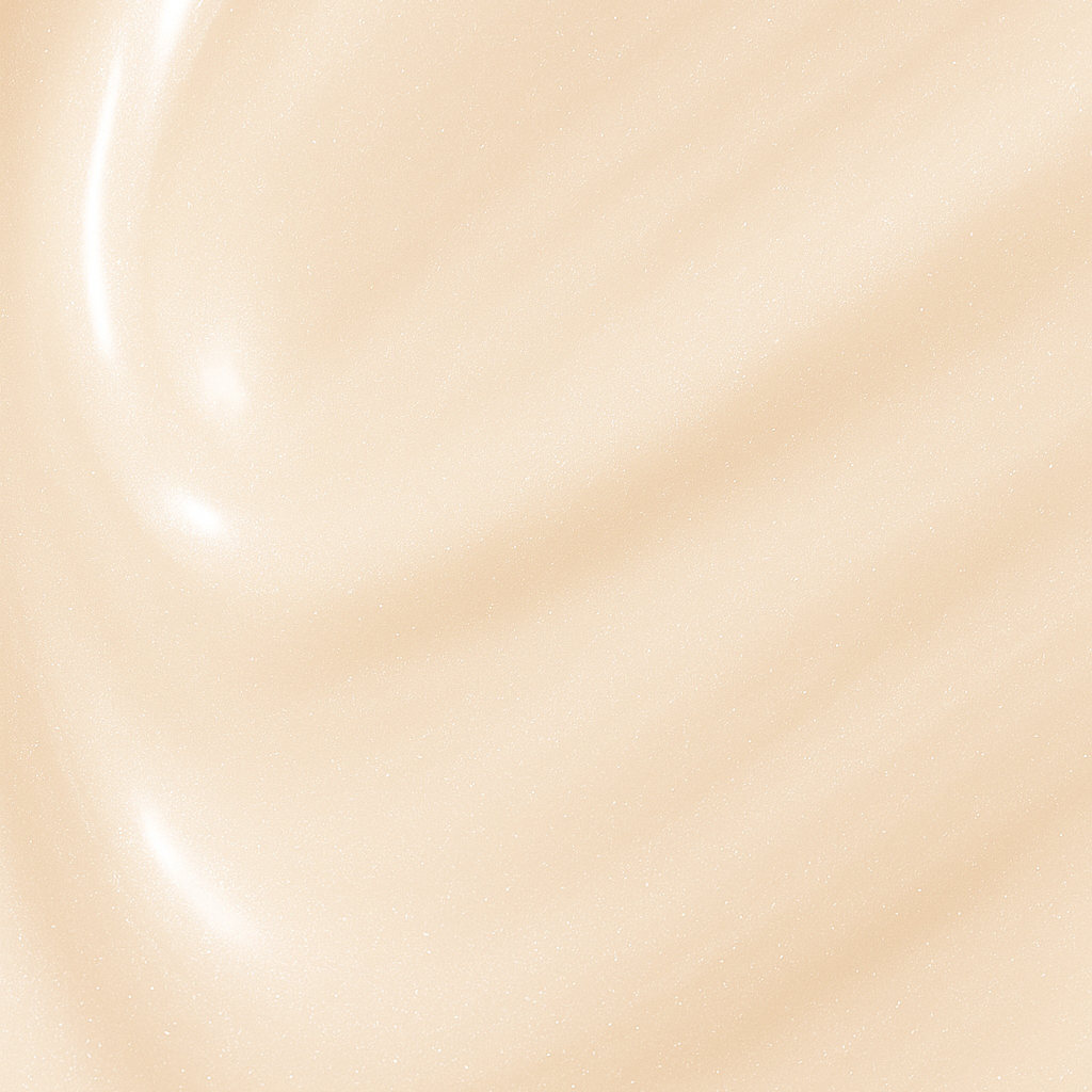 Smooth champagne cream texture of Lucky Chick Dawn Glow Fruit-Infused Illuminizer with radiant shimmer finish.