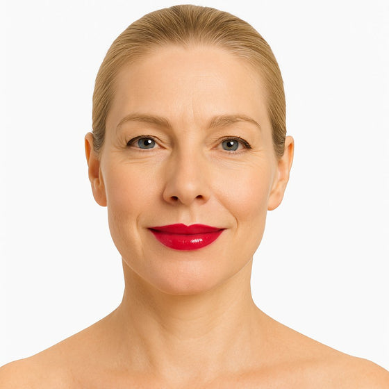 Model wearing Lucky Chick Hydrating Lip Gloss in Desire – bold red glossy lips