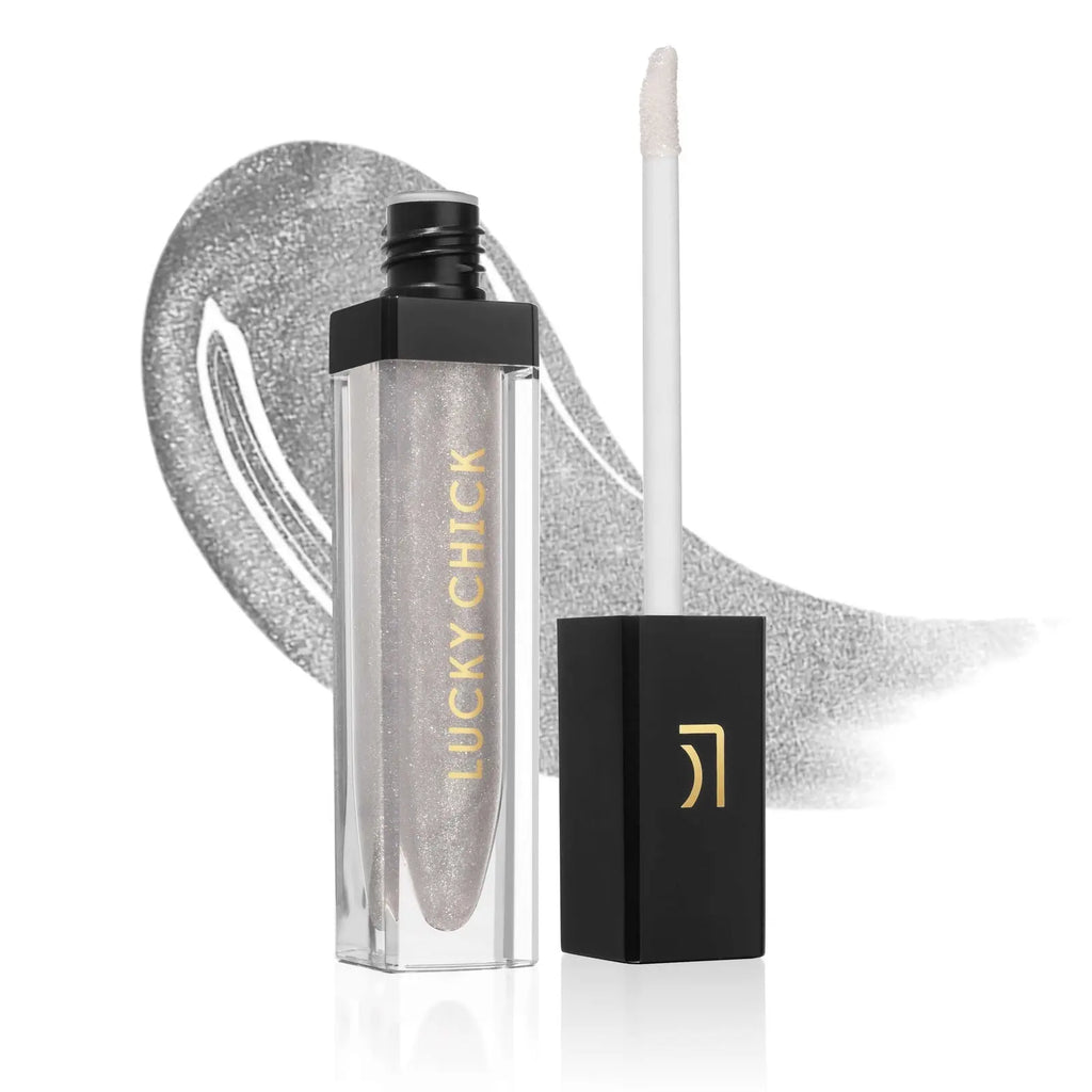 Lucky Chick Hydrating Lip Gloss in Shimmery – clear tube with gold logo and black cap, vibrant red gloss finish